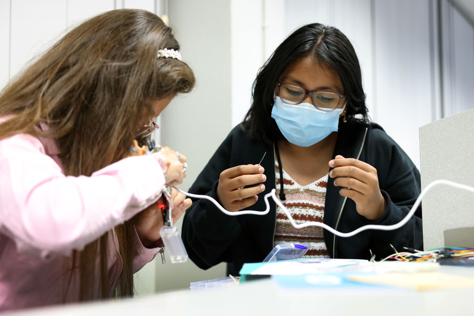 Middle school students work on a hands-on lesson 