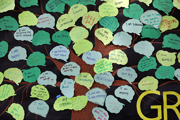 A close-up of post-it notes each with a hand-written goal.