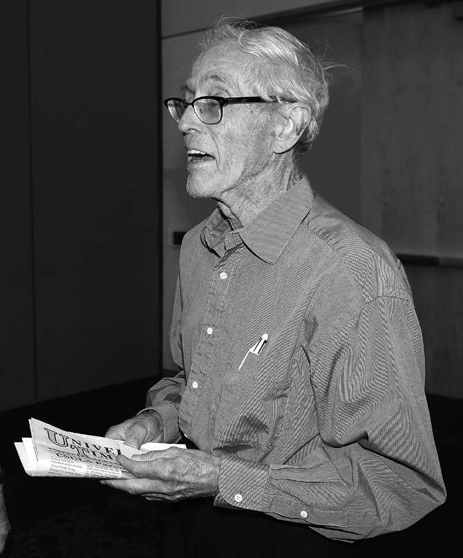 Donald O Dewey with newspaper in hand