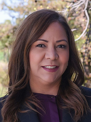 Portrait of woman posing and smiling.