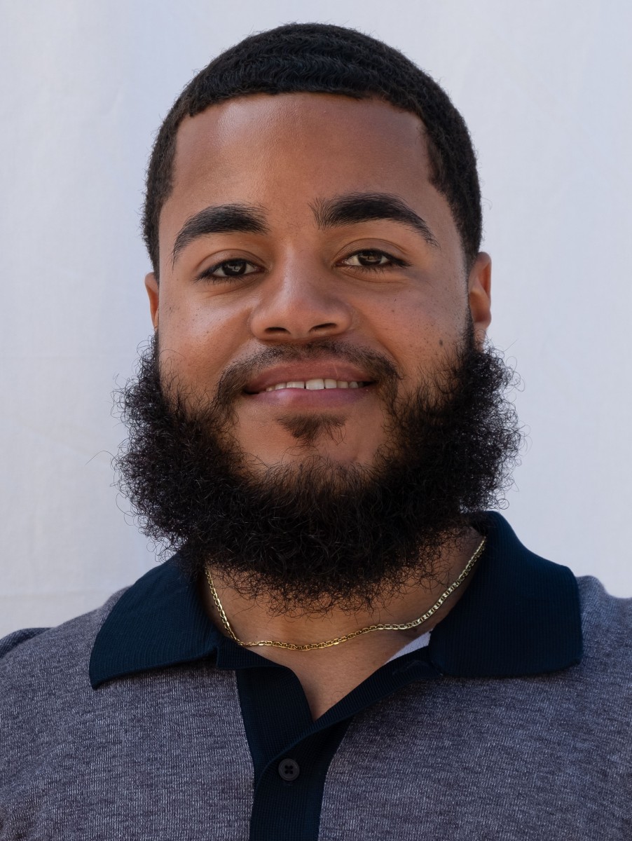 male smiling. Polo shirt.