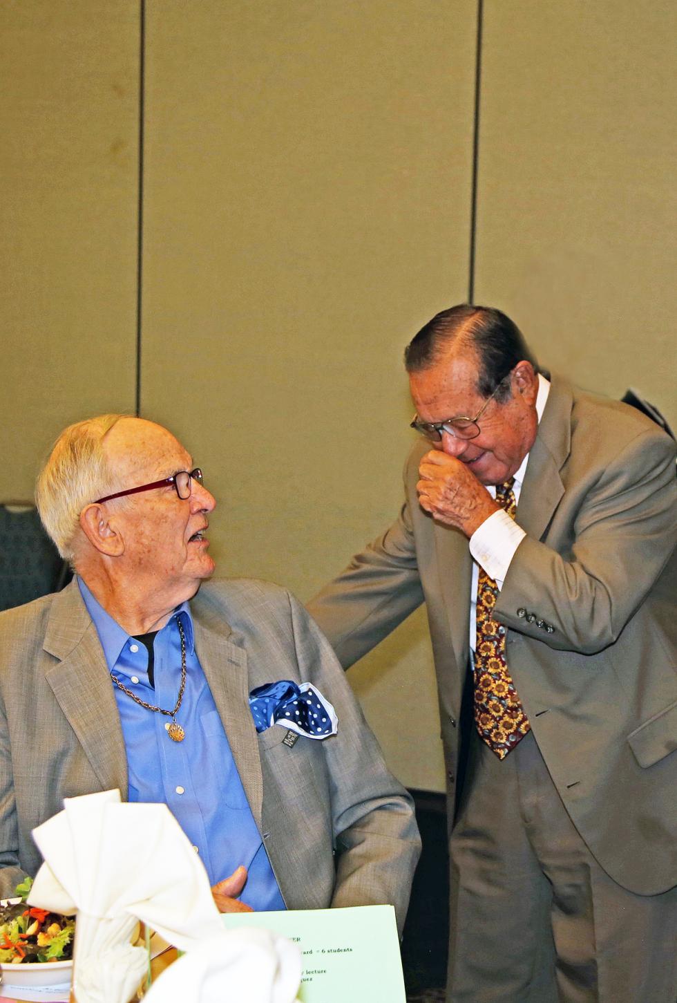 Jack Holt and Vicente Zapata laughing at table