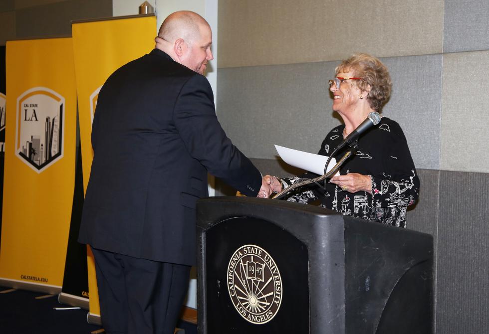 J.Steele, shaking hands with Rosemarie Marshall- holt 