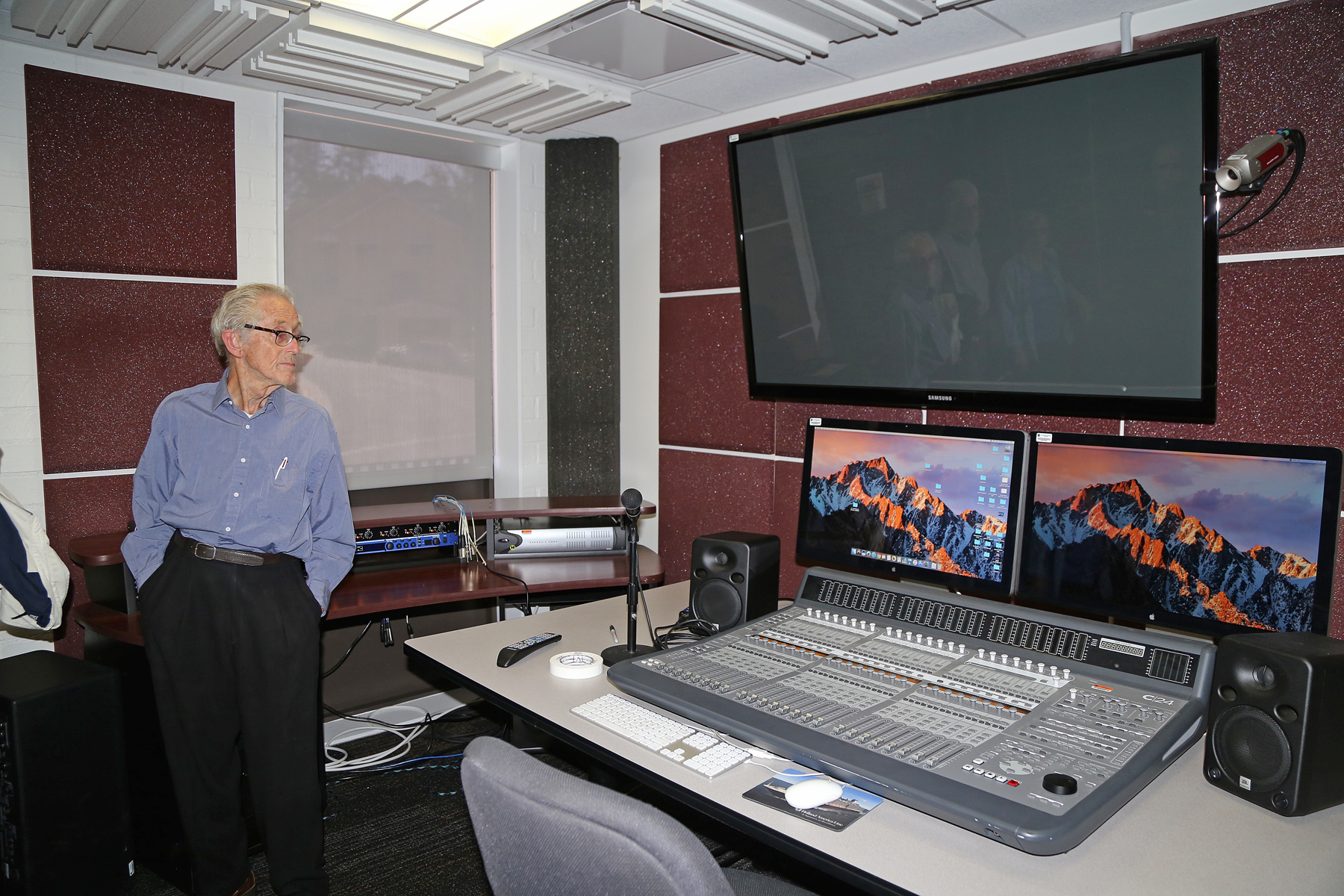 Professor Dewey looking at sound mixing machine