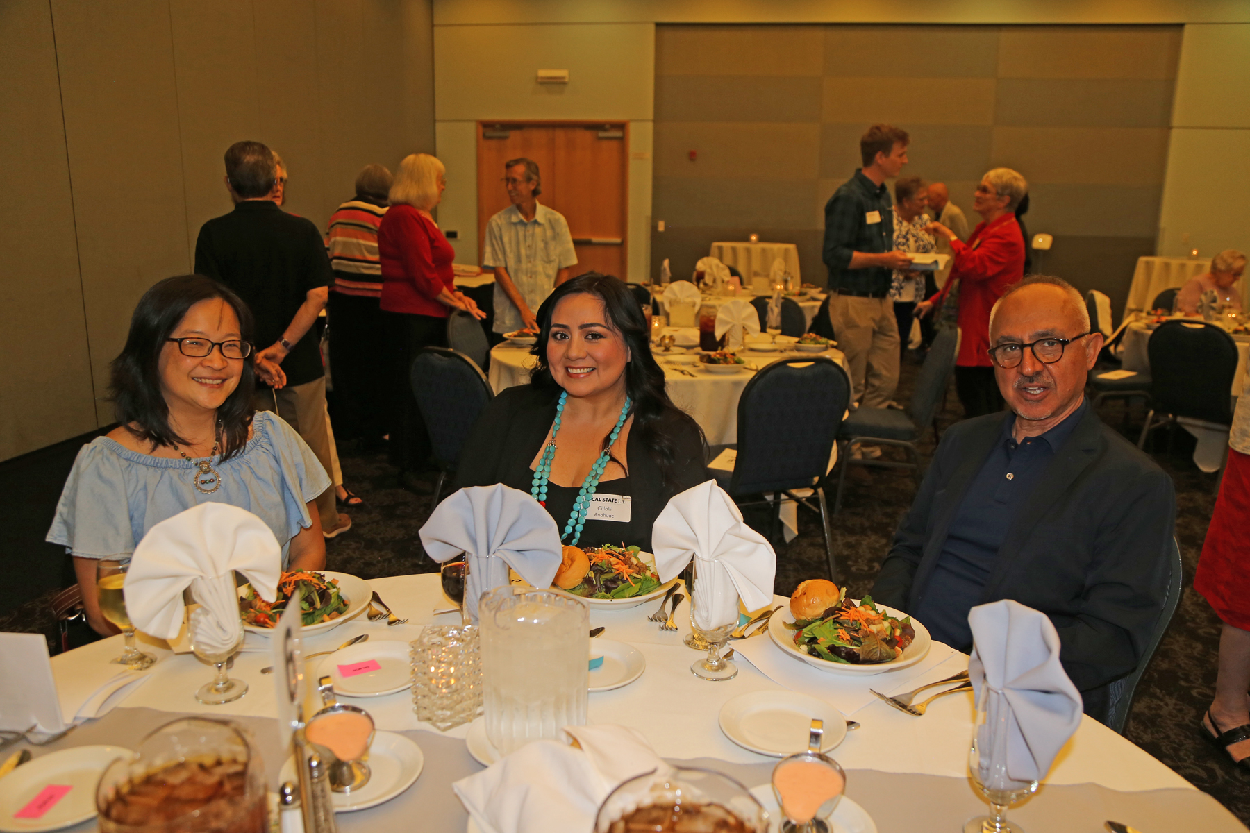 Guests aitting at table at falll luncheon
