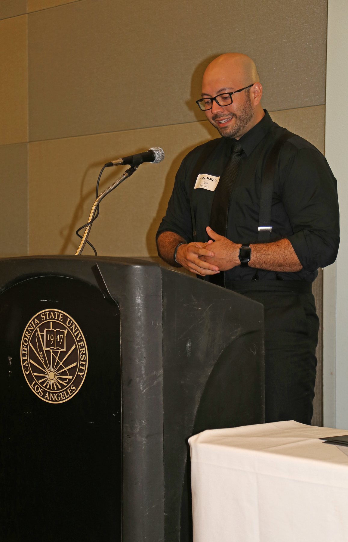 Male Student at podium at fall luncheon
