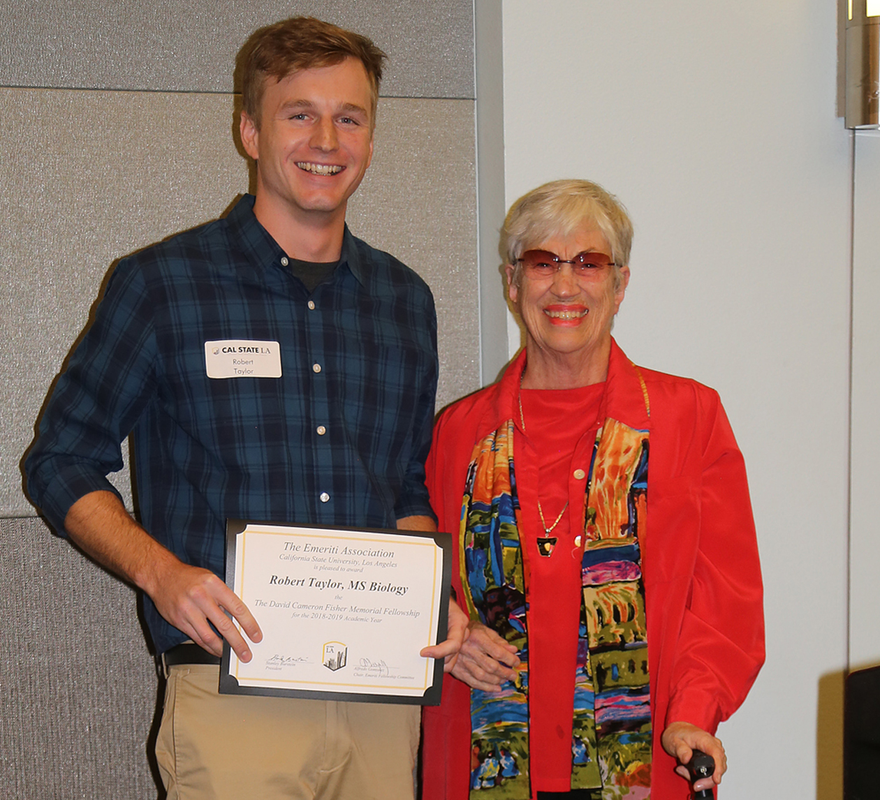 Robert Taylor, student, with professor presenting award