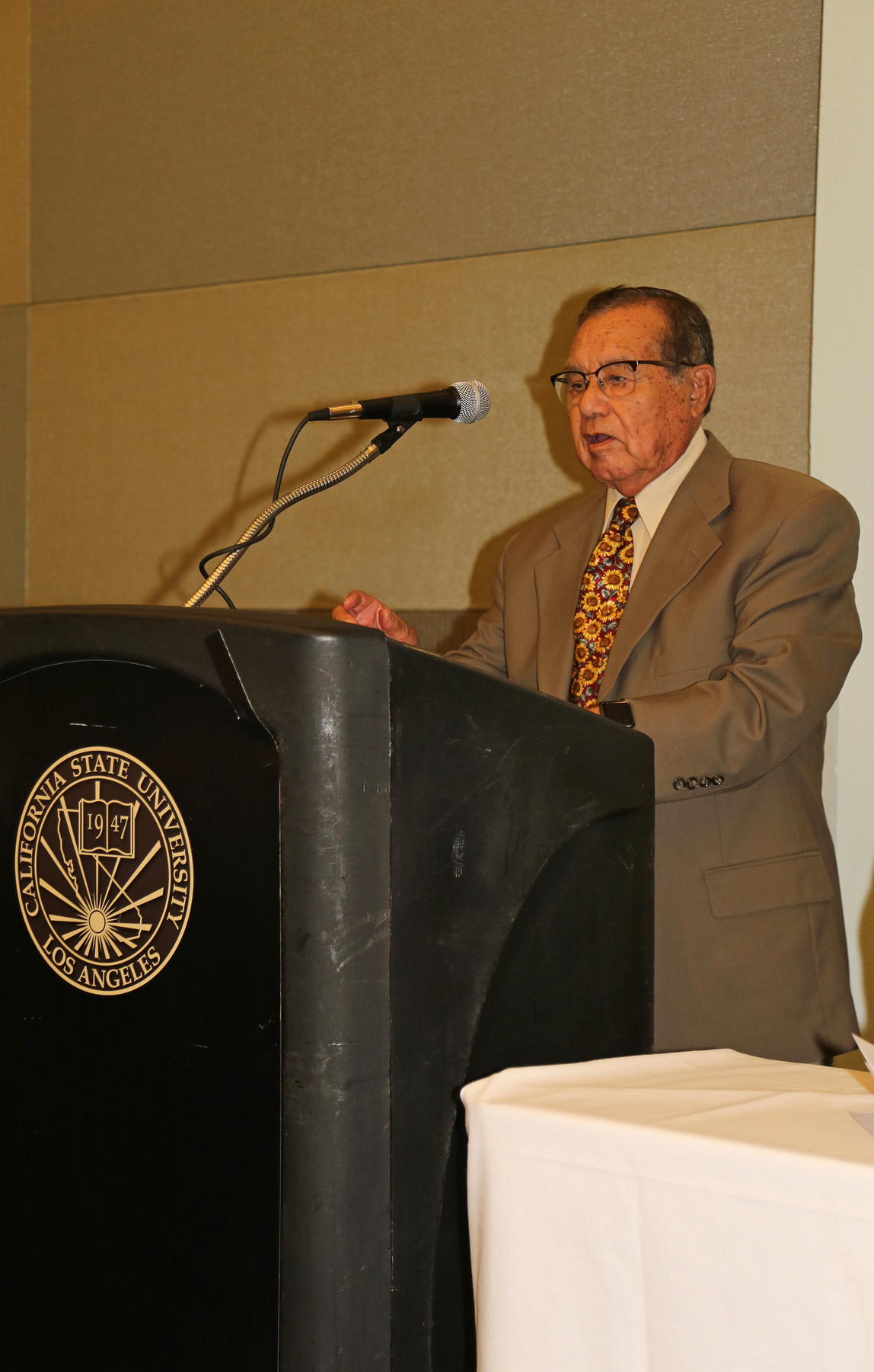 Professor at posium at fall luncheon