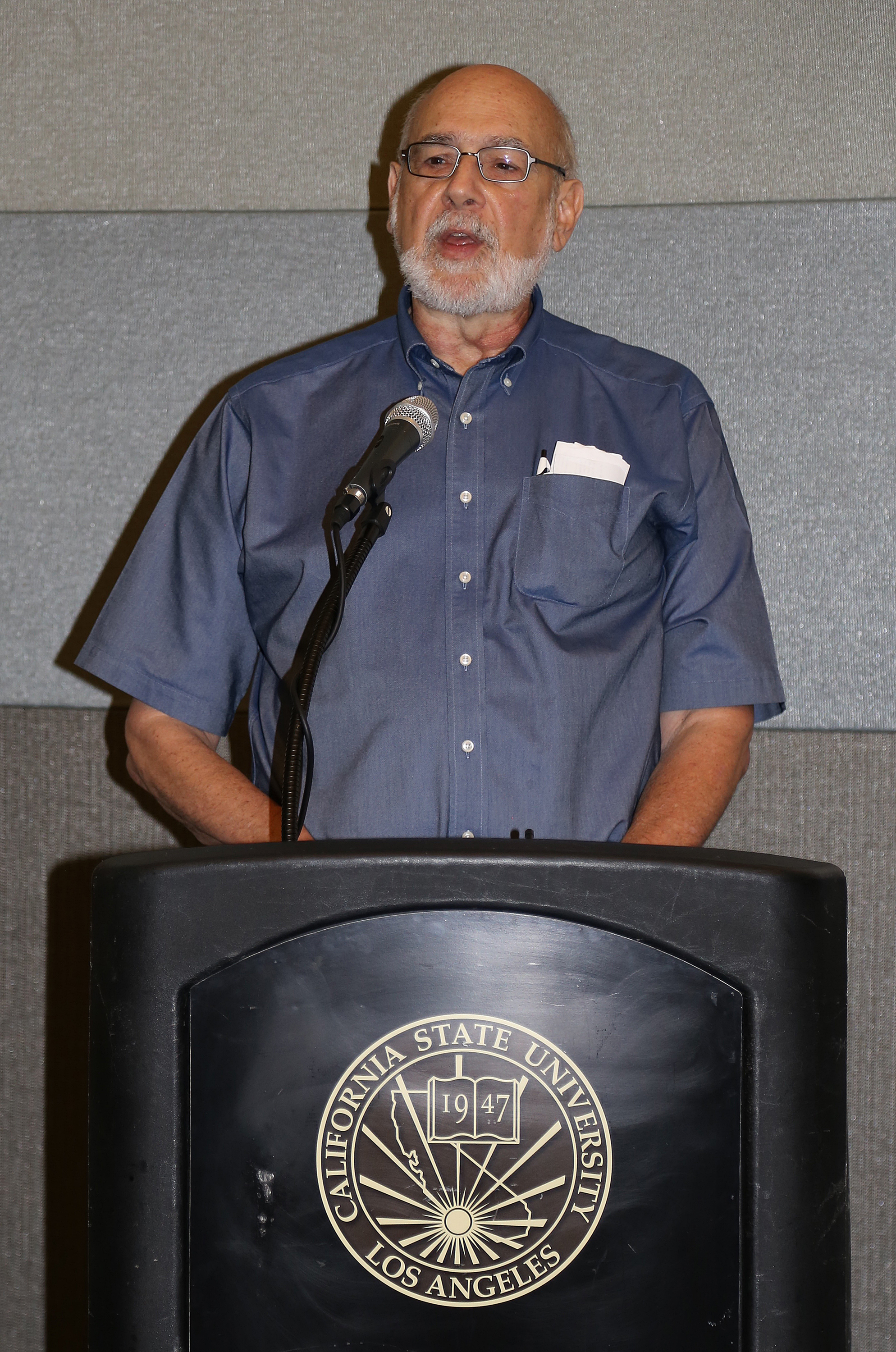 Professor at podium at Fall 2017 Luncheon