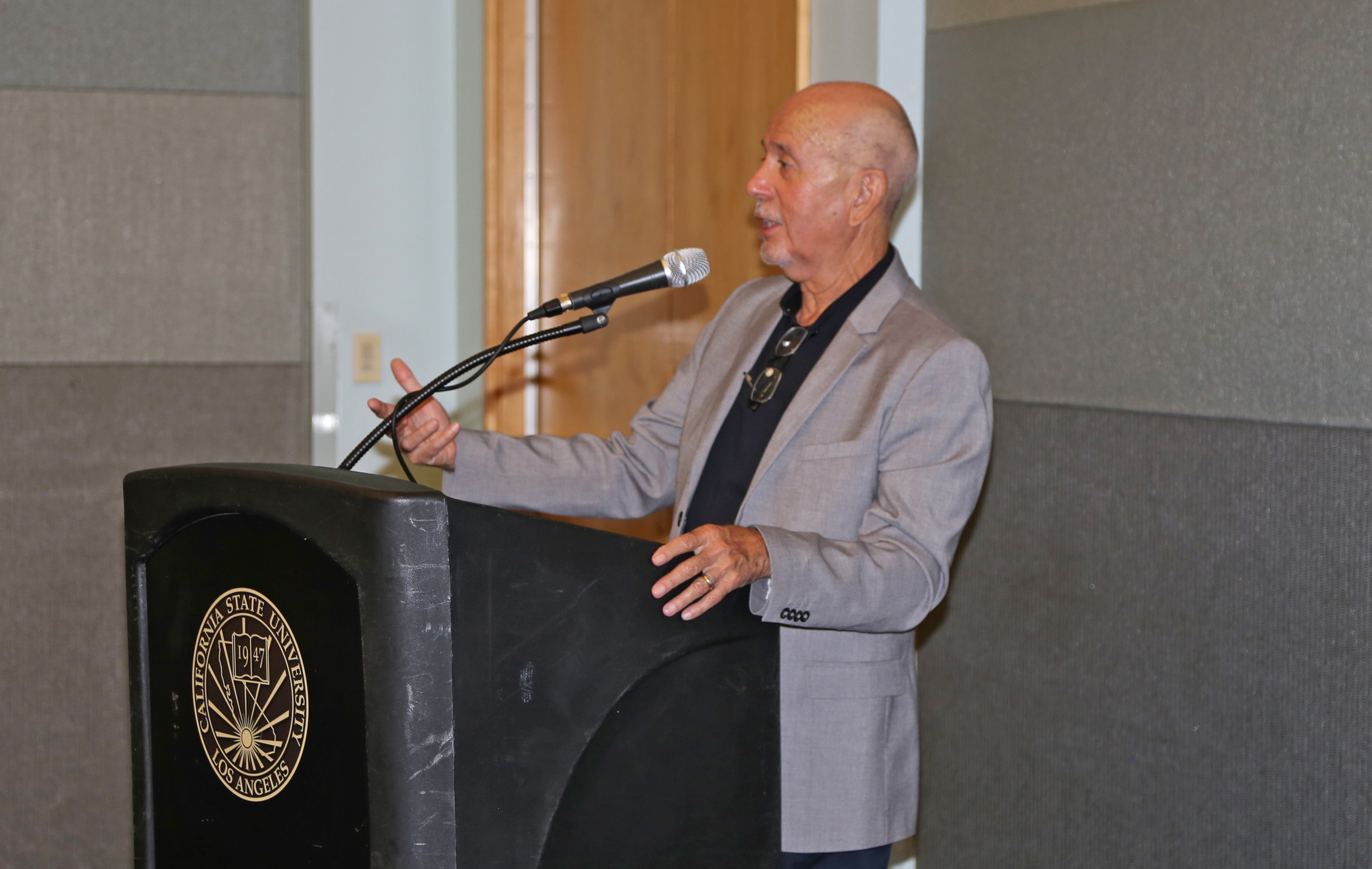 Professor at podium at Fall 2017 Luncheon