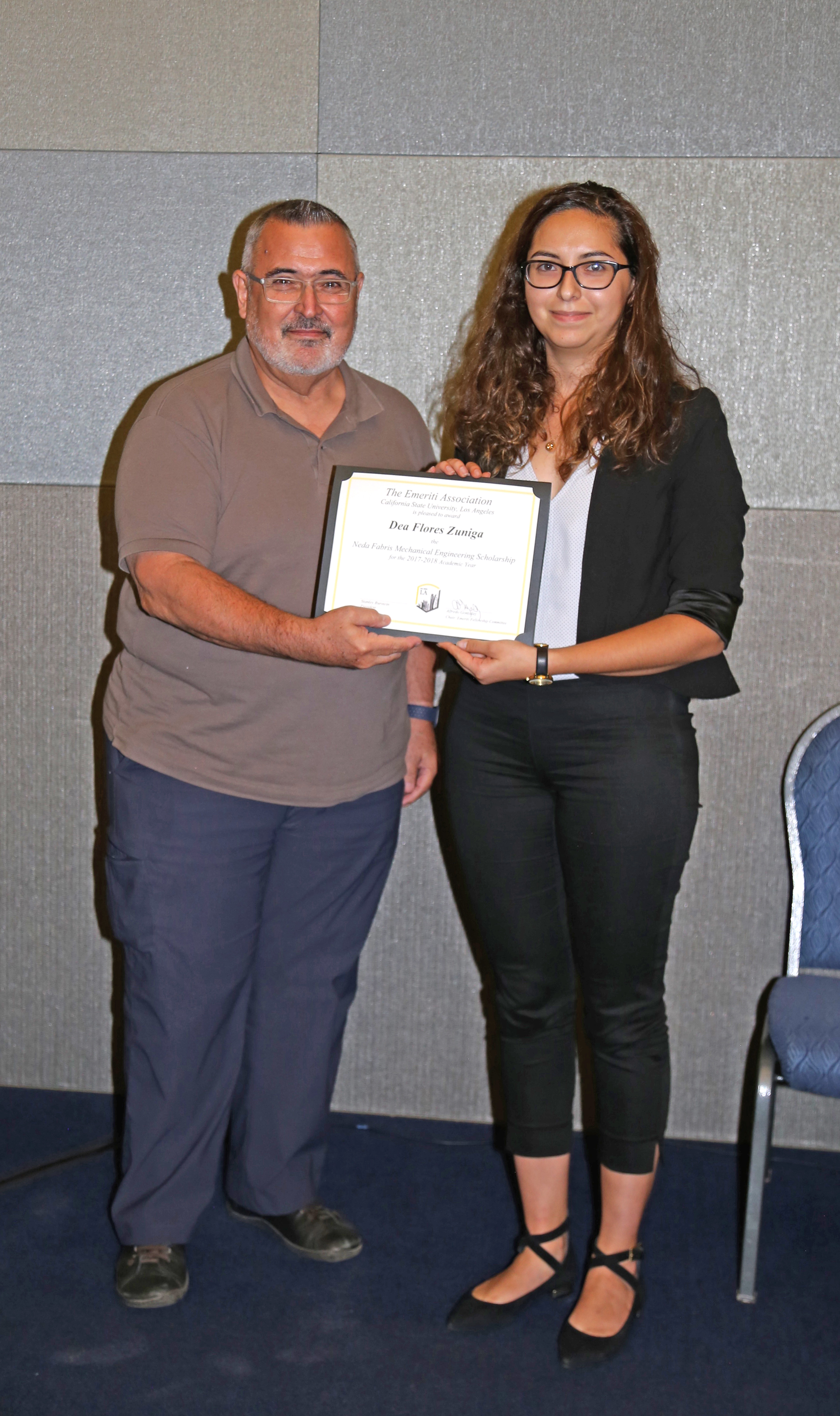 Dea Flores Zuniga and professor at podium at fall 2017 luncheon