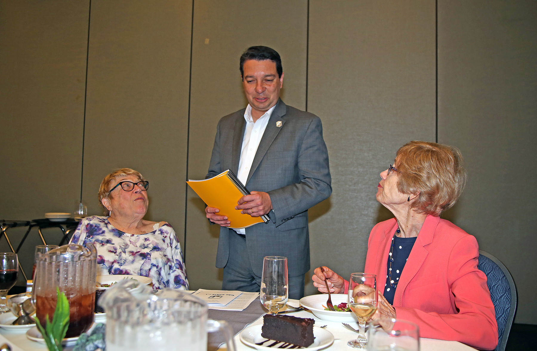Dean Carlos Rodriguez with guests at luncheon