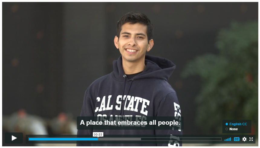 Screenshot of Campaign for Cal State LA video. Student with Cal State LA sweatshirt, English captions read "A place that embraces all people"