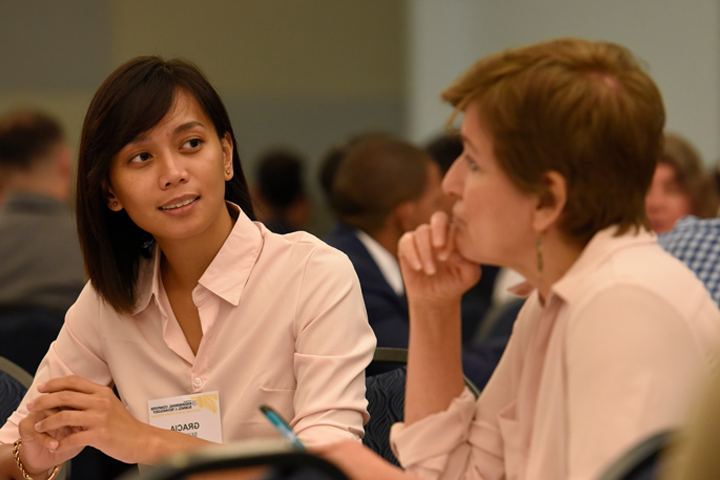 female students works with advisor