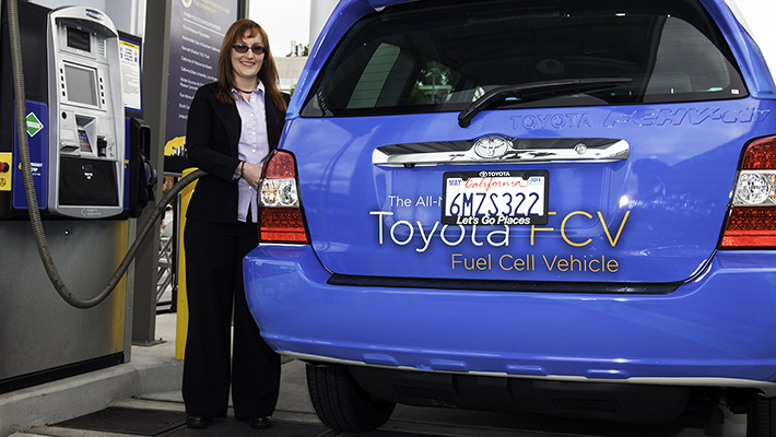 Toyota engineer Andrea Lubawy tests out the pump during the unveiling of the Hydrogen Research and Fueling Station.