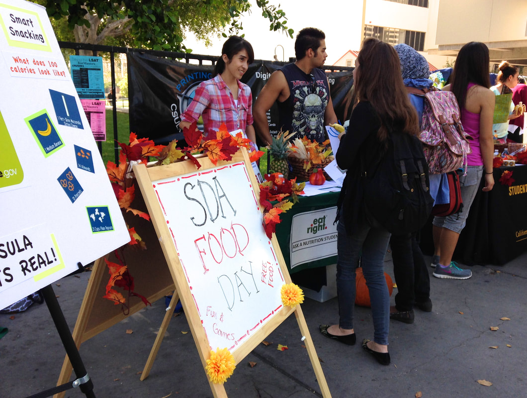 Students handing out nutrition information on campus