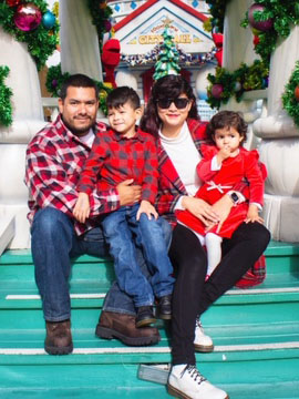 Anthony Martinez, smiling with son, daughter, and wife.