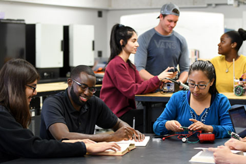 ECST students collaborate, work, and research in lab