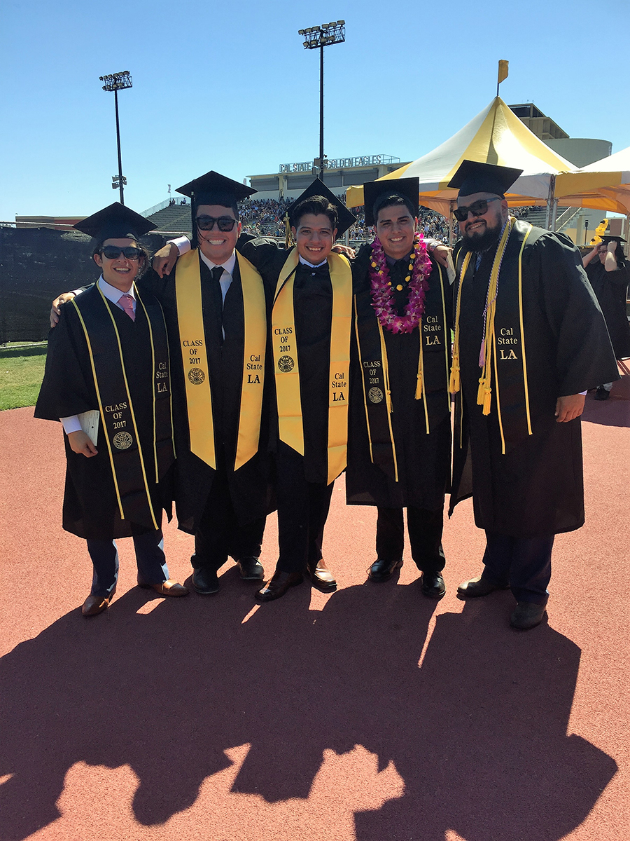 Five graduates in the stadium during Commencement 2017