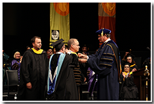 President William A. Covino is invested.