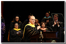 President William A. Covino accepts applause from the crowd.