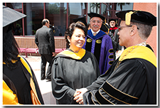 President William A. Covino accepts well-wishes from guests after the Investiture.