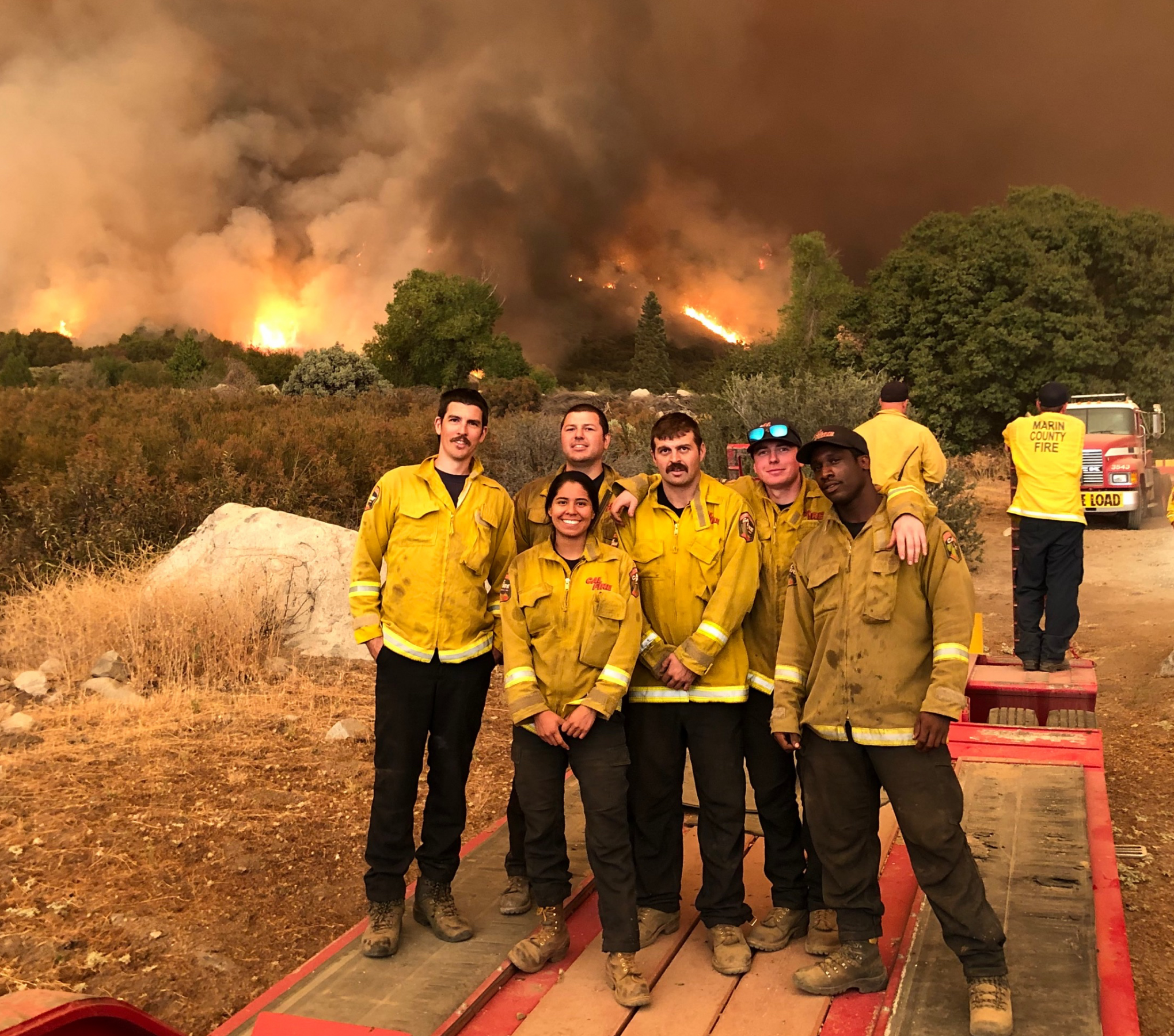 Firefighters in front of blaze