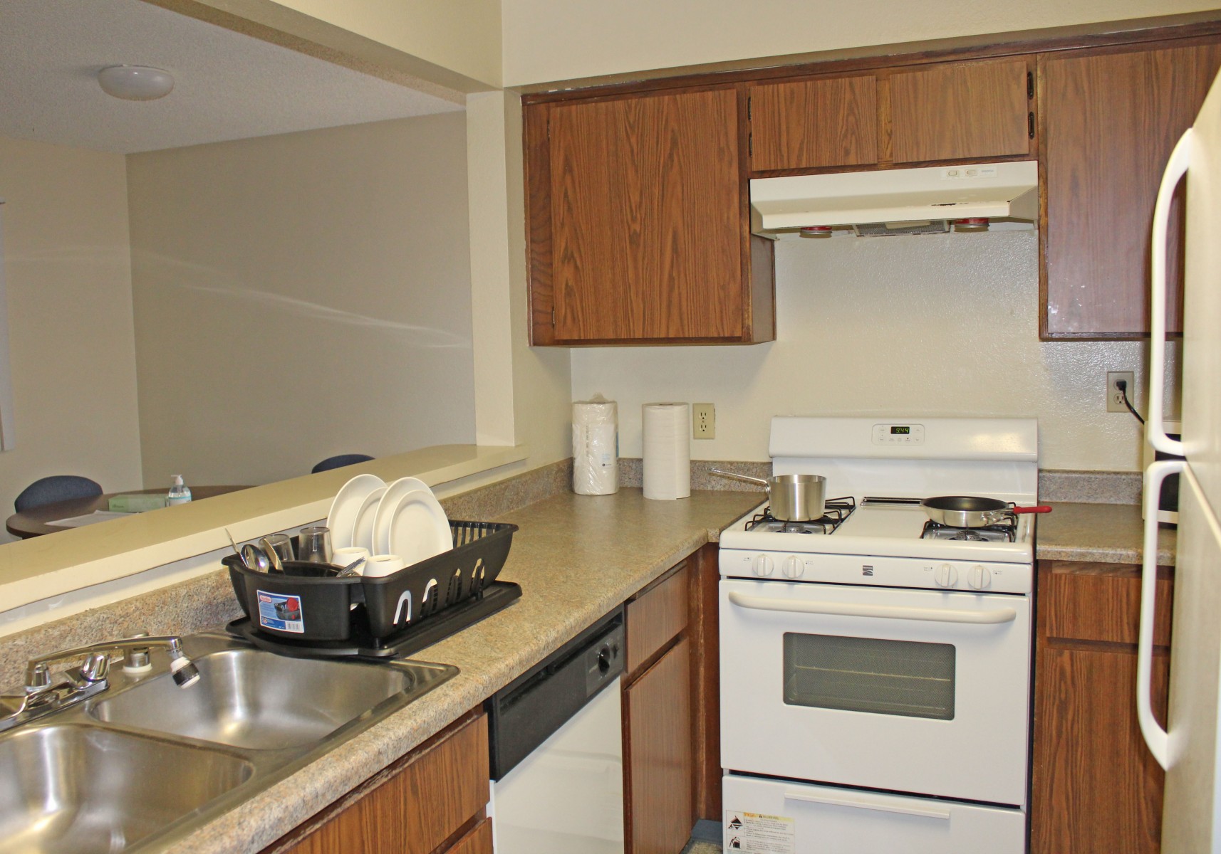 View of kitchen stove, sink and counters
