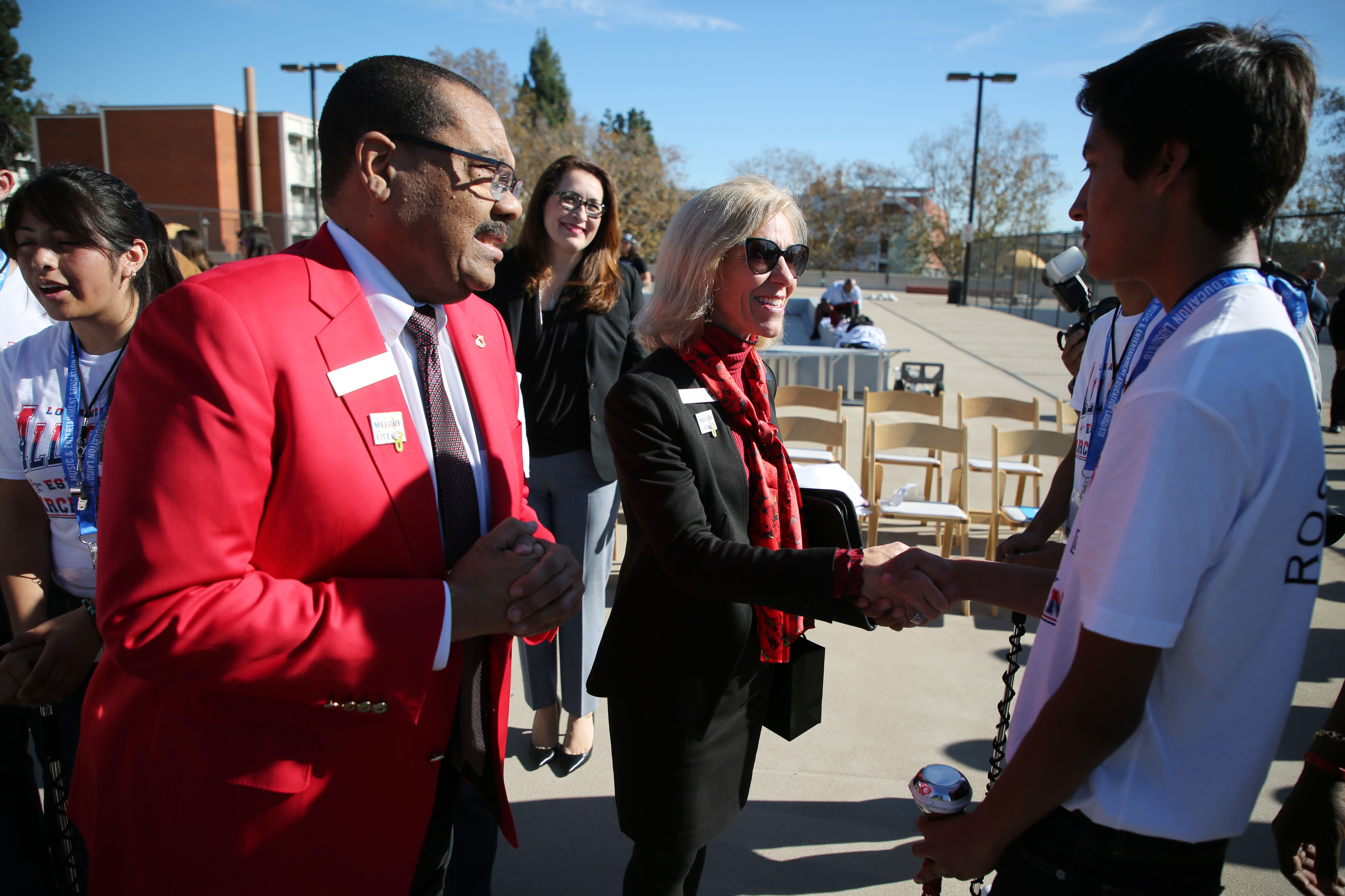 Janet Dial and Gerald Freeny greet student band members