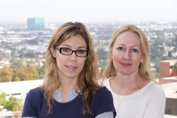 Christina and Sandy pose with the city of Los Angeles as backdrop