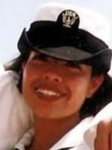 Janet, wearing her U.S. Navy uniform and smiling.