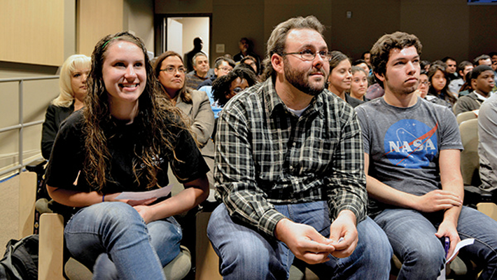 Engineering students listen to the NASA astronauts.