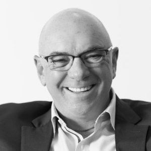 Black and white picture of bald man and glasses 