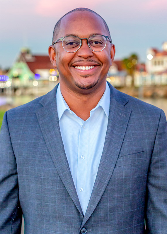 Mayor Rex Richardson wearing a dark blue suit with a light blue dress shirt