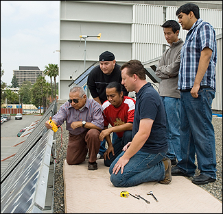 Solar panel team members Cesar Cardenas, Jesse Morales, Edgar Avalos, Jacob Dayneko, Jimmy Hoo and Jeovany Aguilar gauge the output of their panels on top of the Engineering and Technologybuilding. There are two, 77-panel grid systems that will power lab 