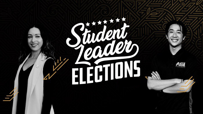 Two students standing, smiling confidently. Student Leader Elections.