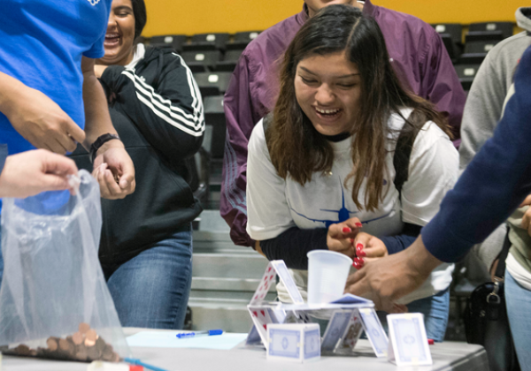 girl excitedly looks on experiment