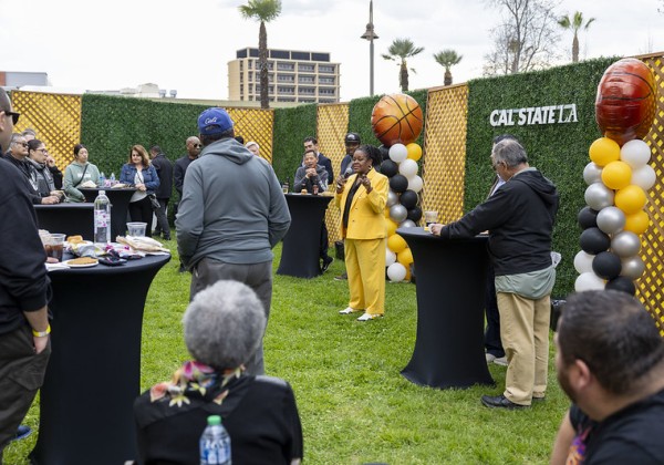 Cal State LA alumni and community gathered around President Eanes as she speaks.