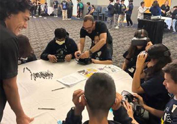 Students working together on a project as part of the ledership program