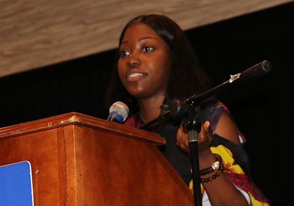 Cal State LA Student at Podium giving her conference presentation