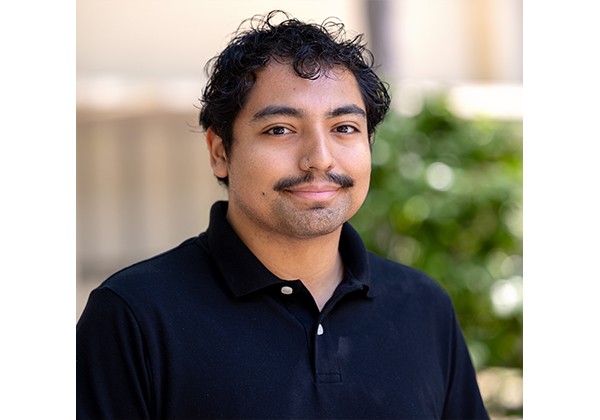 Professor Aguirre wearing a black shirt