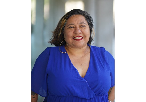 Anita Revilla Tijerina wearing a blue top standing outside