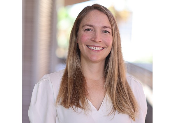 Professor Bower smiling wearing a white top