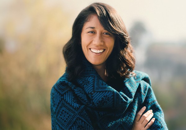 Jessica Bremner wearing a green sweater smiling