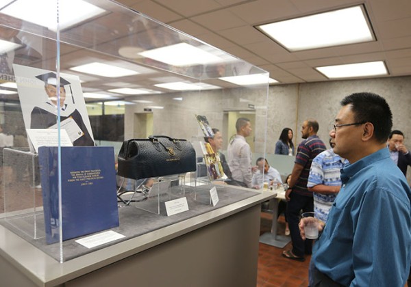 Libary visitor looking at exhibit celebrating the AAPI community