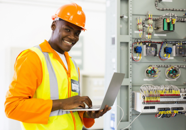 Man working on electrical panel.