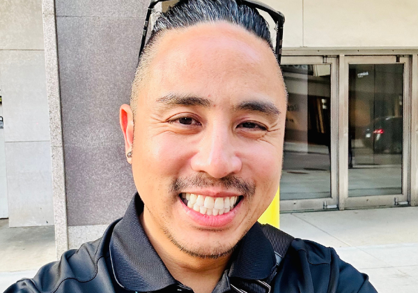 a person in a black shirt taking a selfie