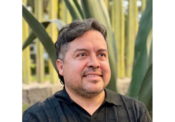 José Anguiano wearing a black polo shirt outdoors