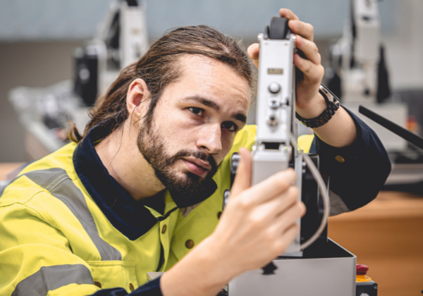 Man working in mechanical shop.