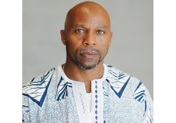 Nana Lawson Bush headshot in front of a grey background